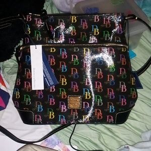 Dooney and Bourke handbag black with multicolored db all over it.